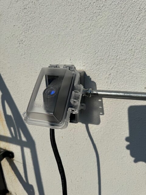 Residential EV charger wiring and load manager installation in a Los Angeles home