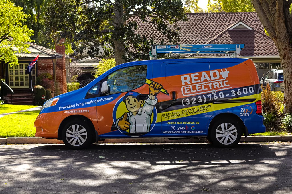Ready Electric electrician inspecting an electrical panel for a Los Angeles homeowner
