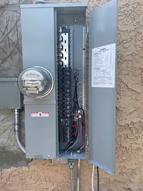 Ready Electric electrician inspecting old wiring in a Los Angeles home